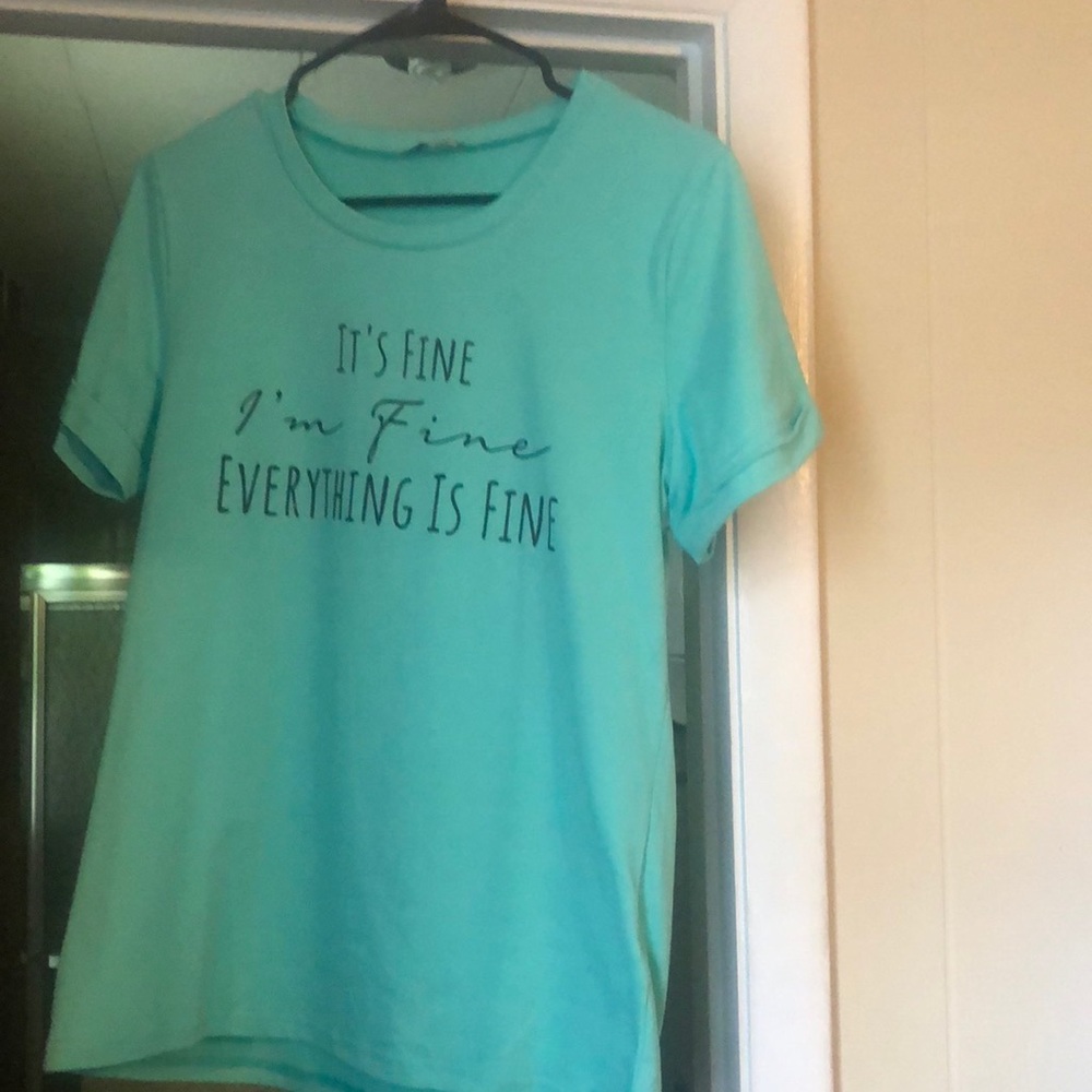 Great condition. Light green t-shirt